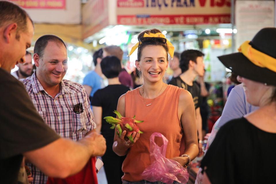 guests are shopping at local market