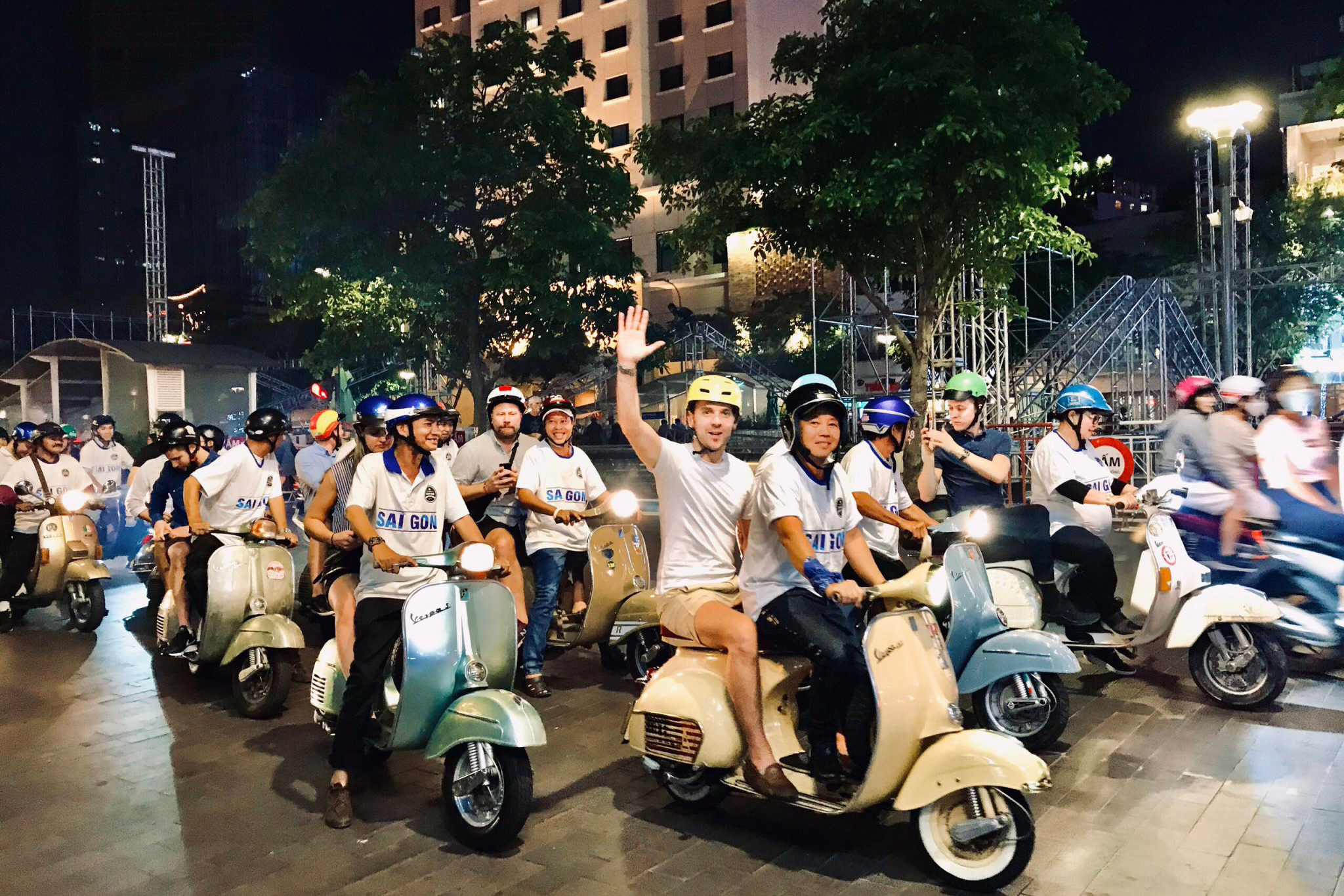 Boutique Mekong River Cruise 16 Guests are taking a vespa night tour in Saigon