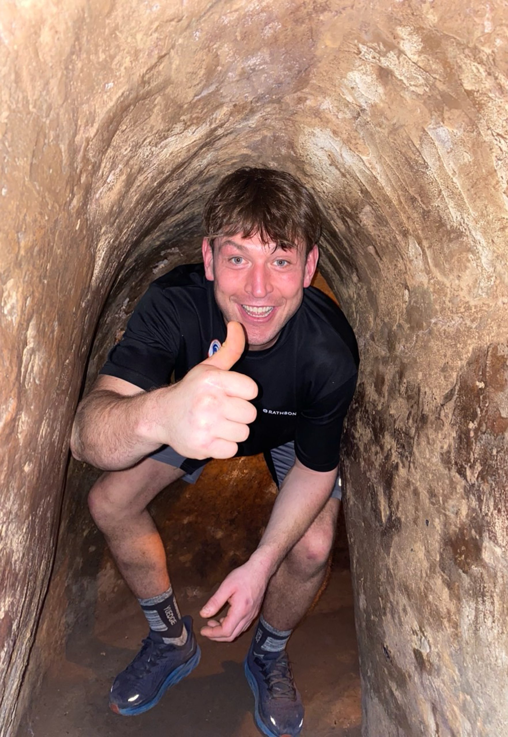 guest is taking the underground tour of Cu Chi