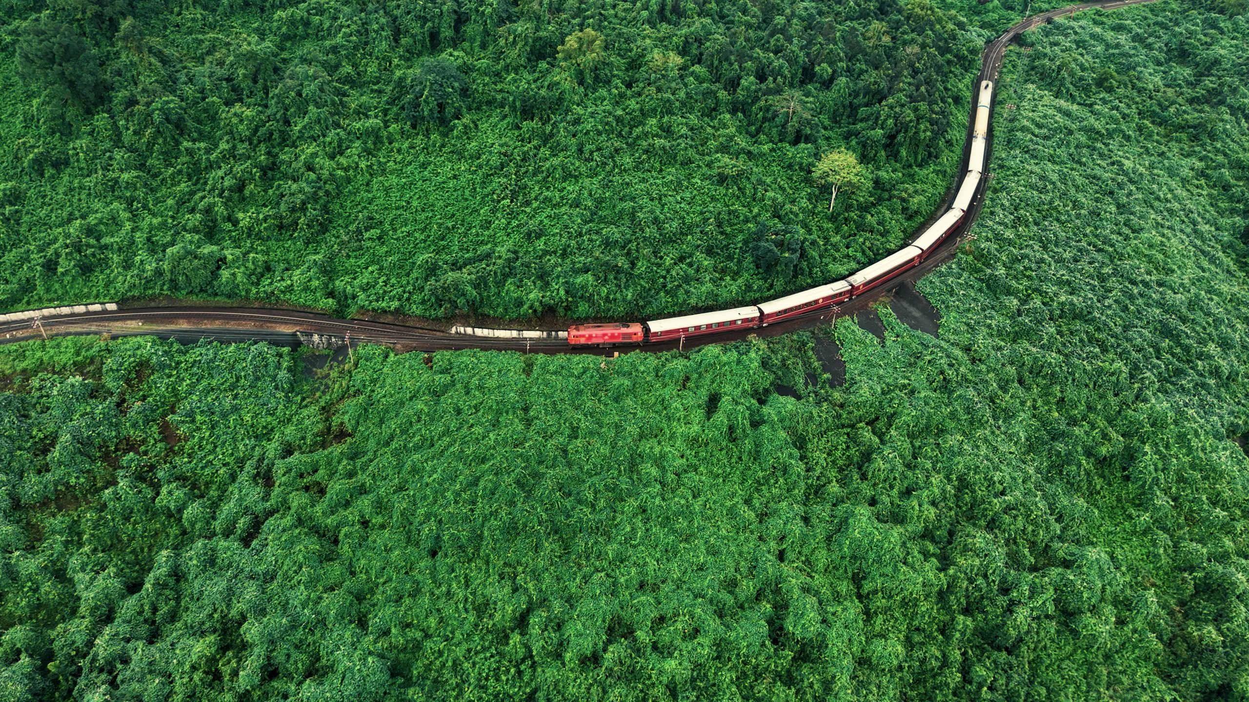 S Journey Train going through mountains and sea