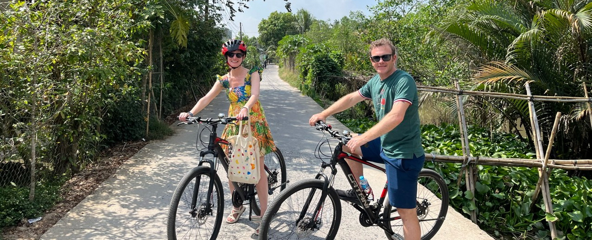 2 guests cycling in the mekong delta