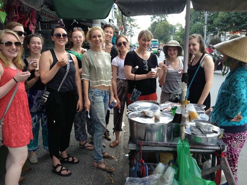 A group of girls from Loyola University taking a food tour