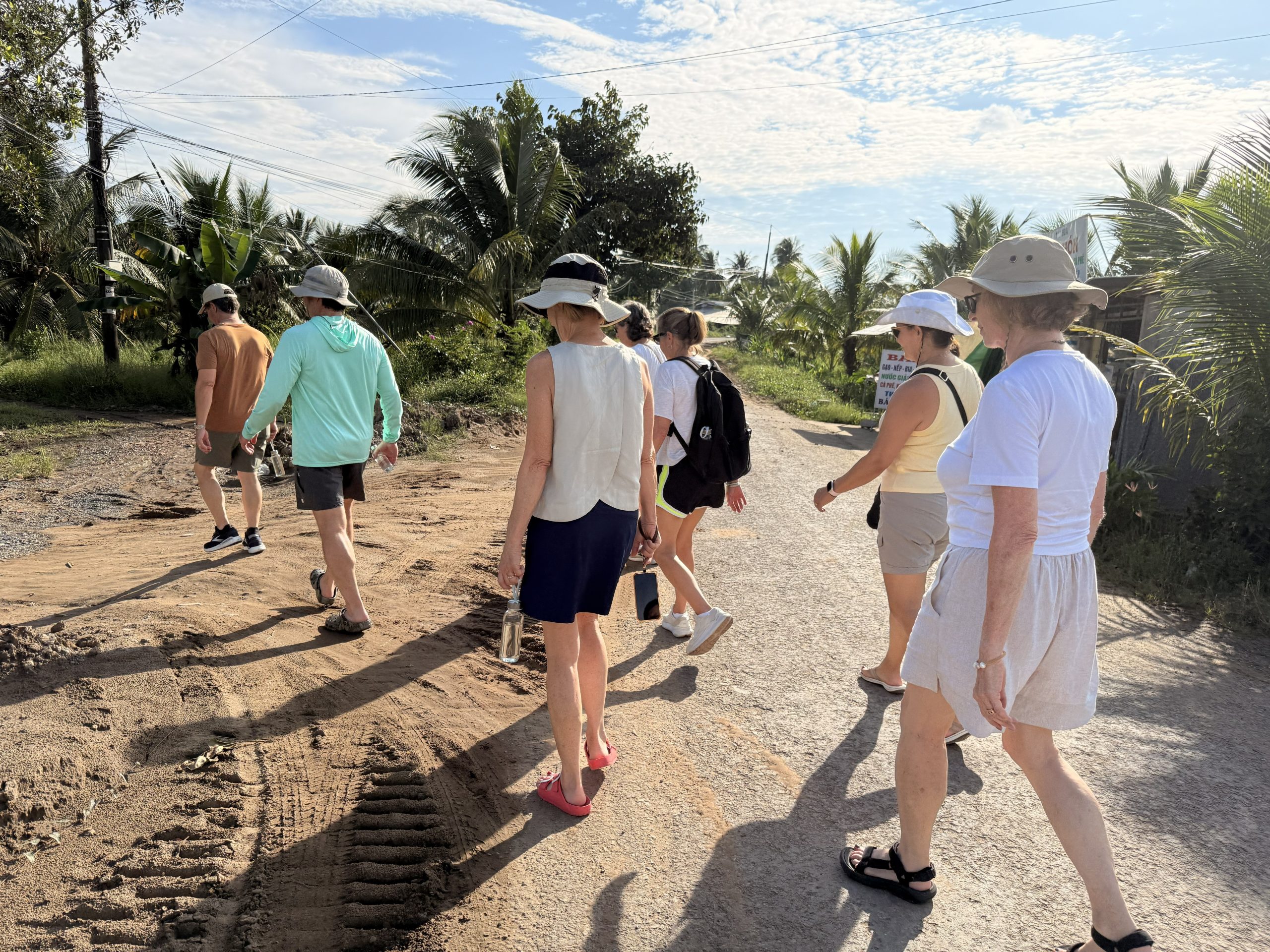 a group of guests taking a light trekking in the Mekong Delta