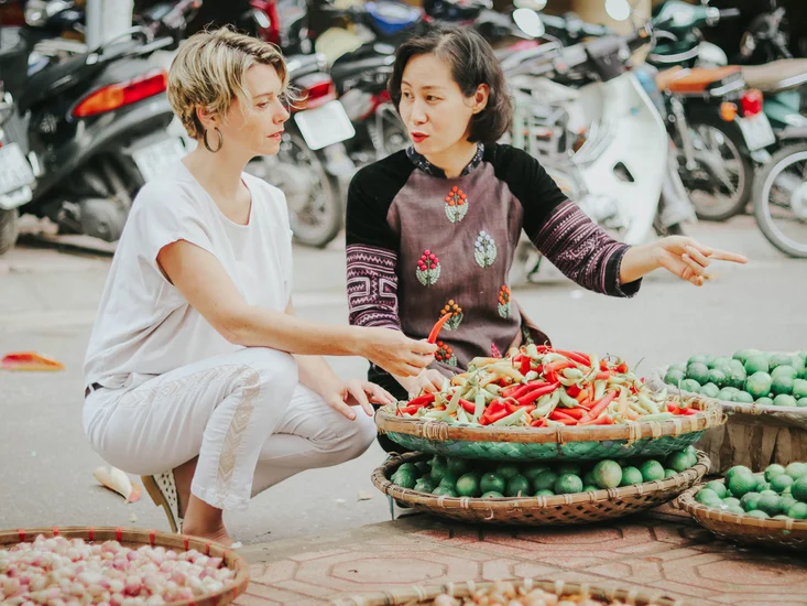chef Ai with guest at a local market