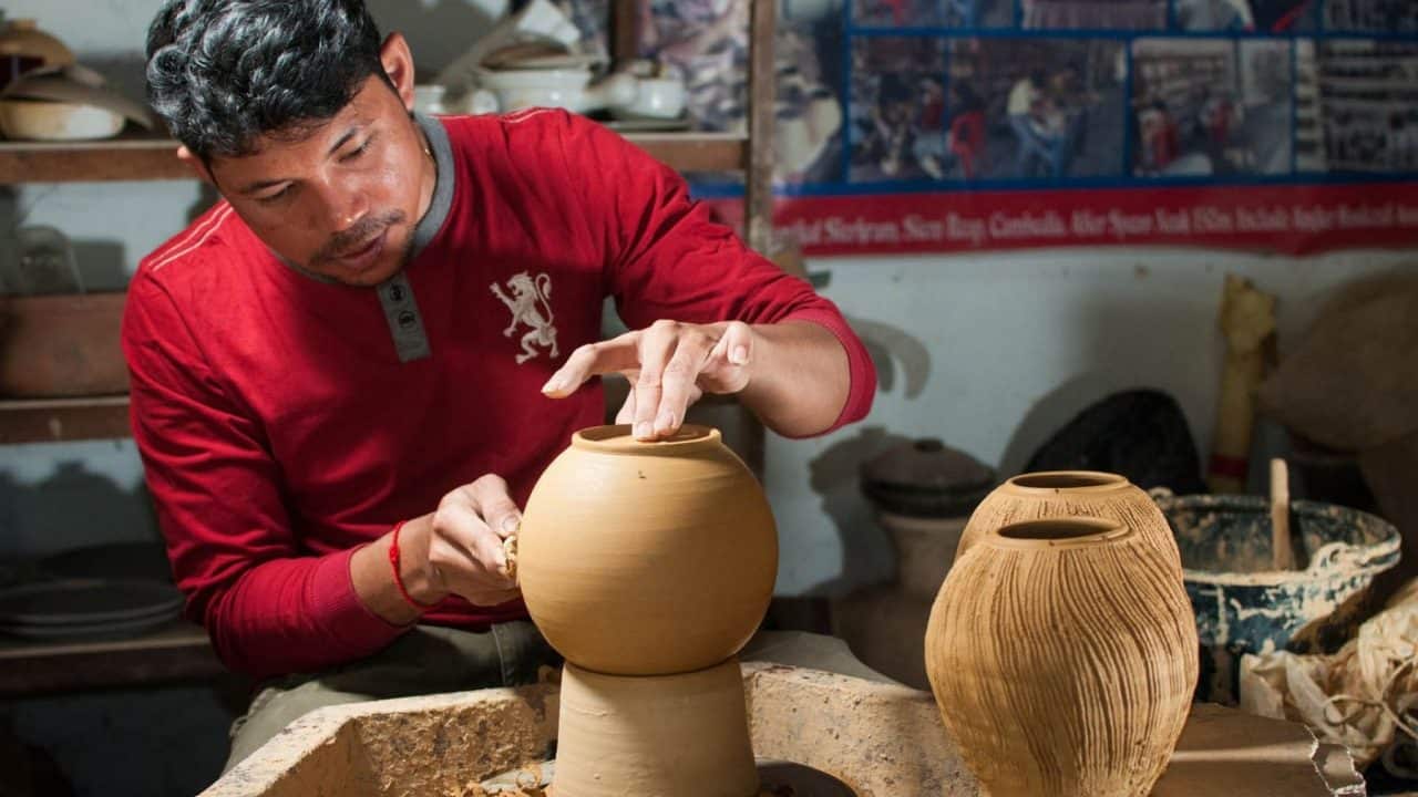 Boutique Mekong River Cruise 6 a khmer artisan making clay pot