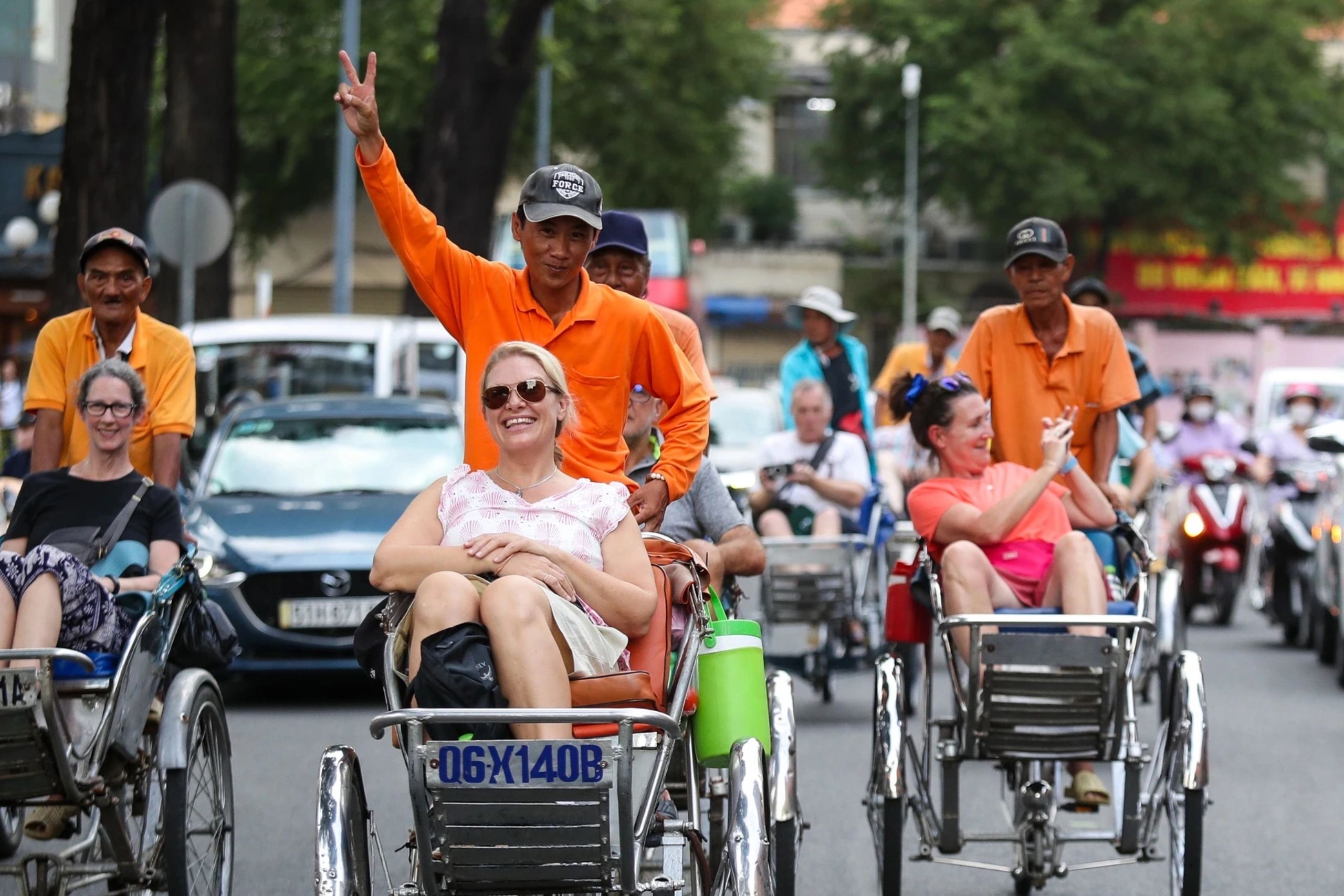 Guests are taking a cyclo ride in Saigon