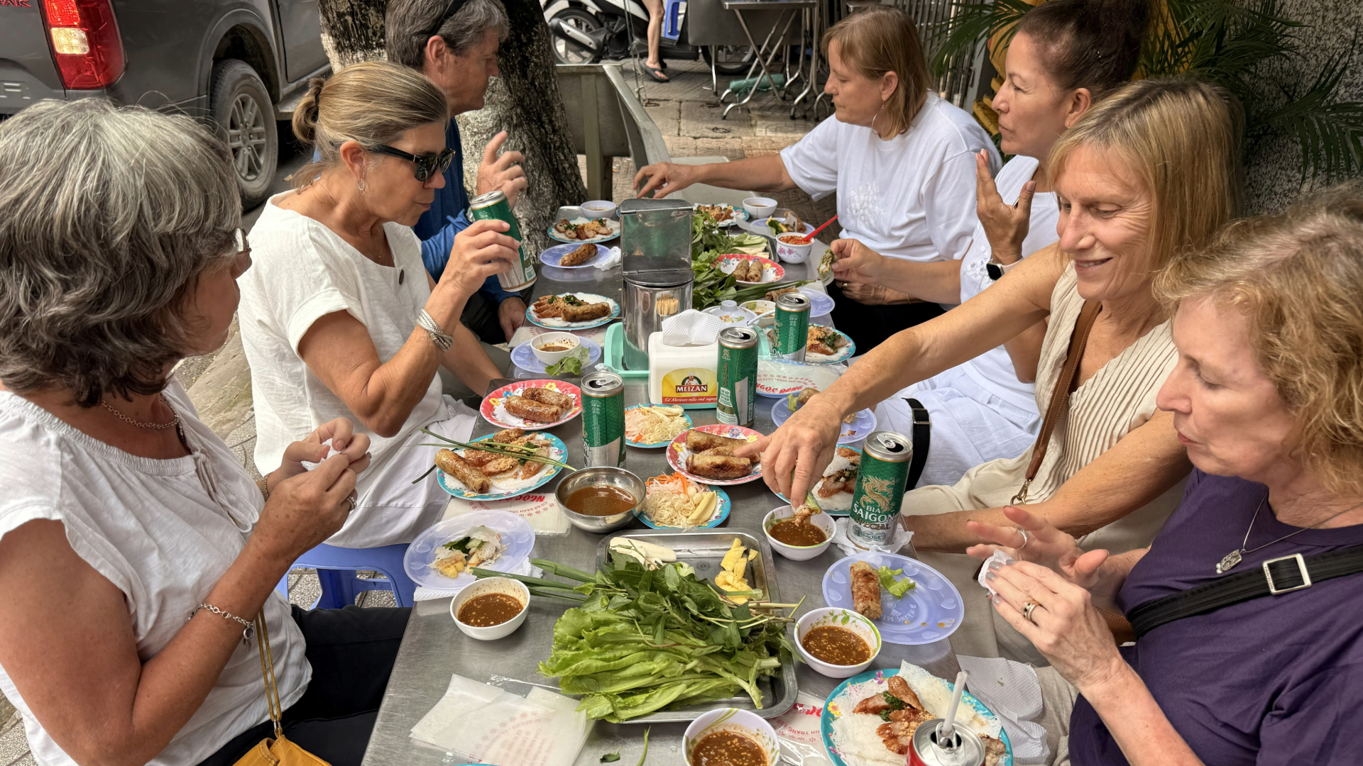Guests enjoy local BBQ skewer