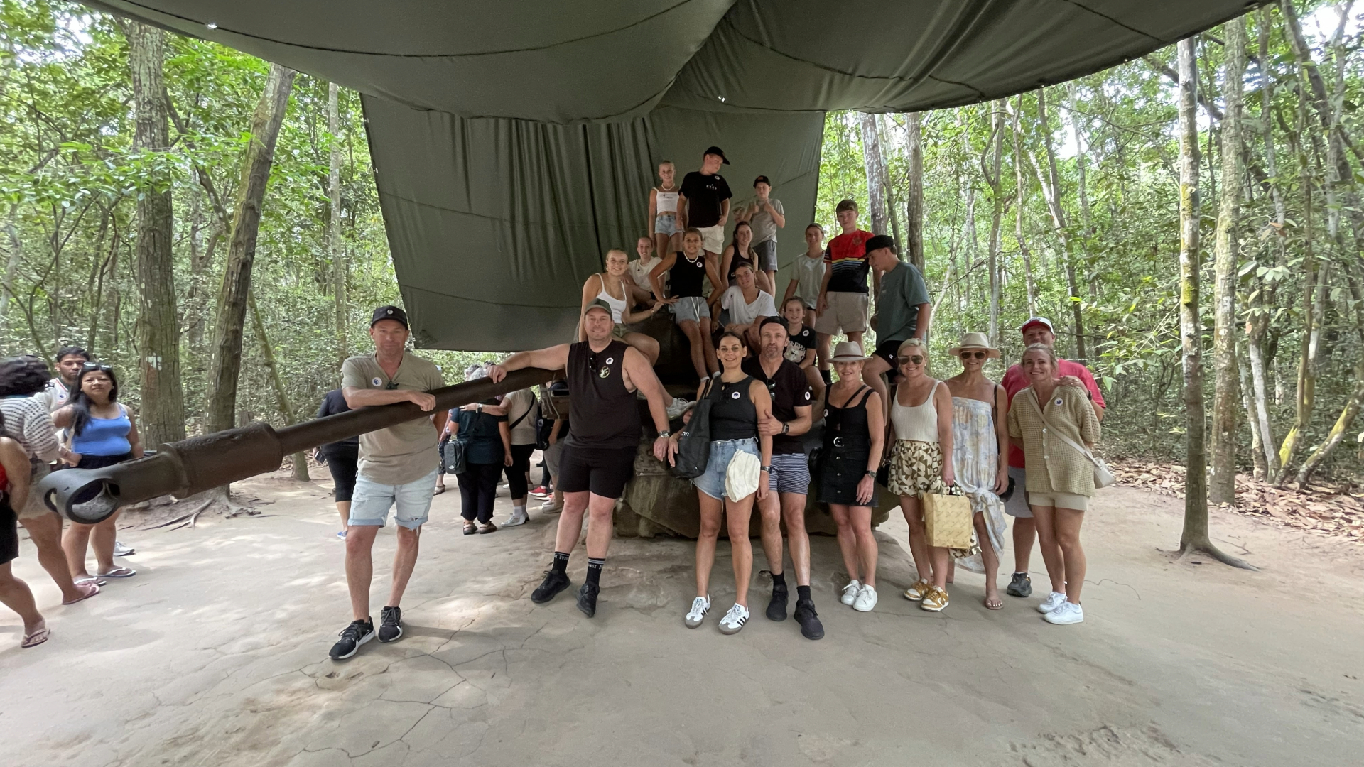 Family groups taking photo at M41 Tank
